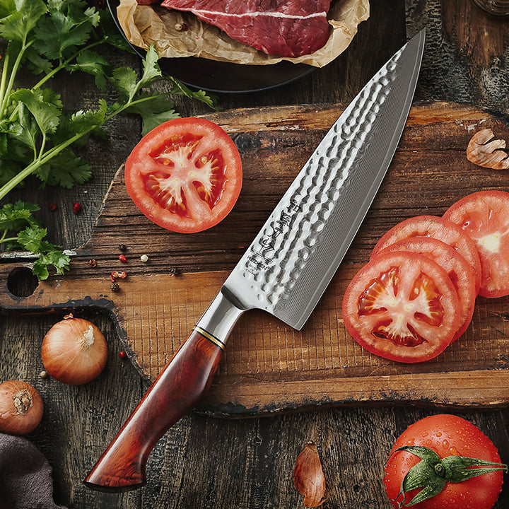 Hezhen B30R Master koksmes naast gesneden tomaten