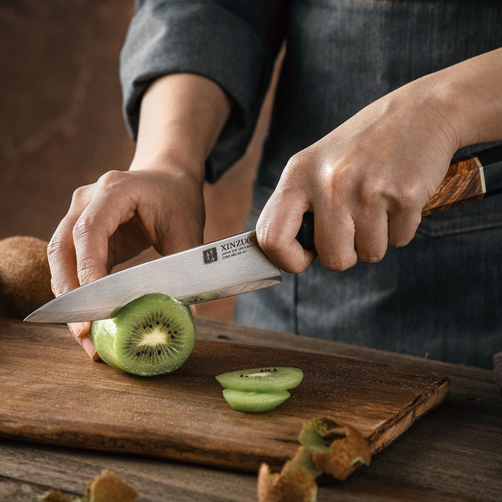 XinZuo F5 Zhen groentemes snijdt een kiwi