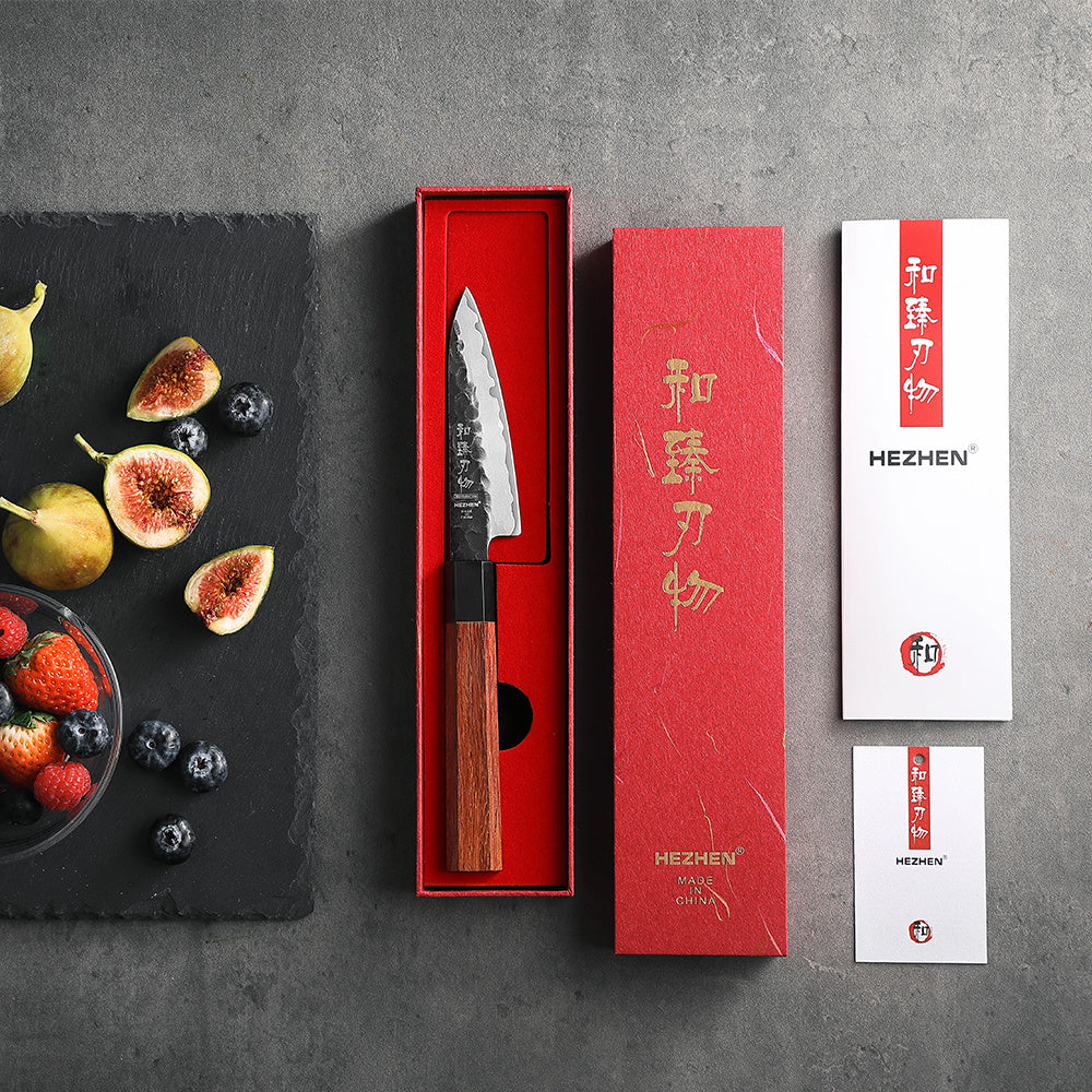 Hezhen PM8S Retro schilmes naast rode doos en fruitschaal