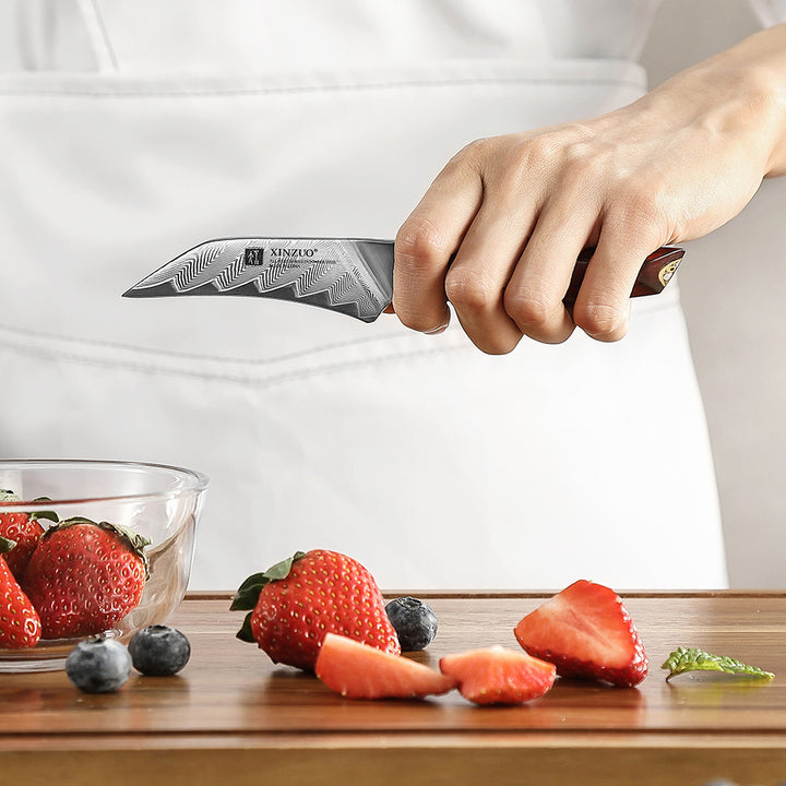 X03 Xing schilmes snijdt aardbeien