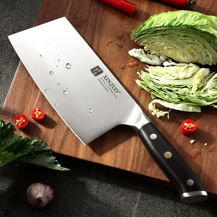 XinZuo B13S Yu cleaver naast gesneden kool en pepers